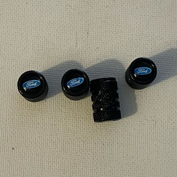 Ford valve Stem caps in Black set of 4 NWT - Picture 1 of 4
